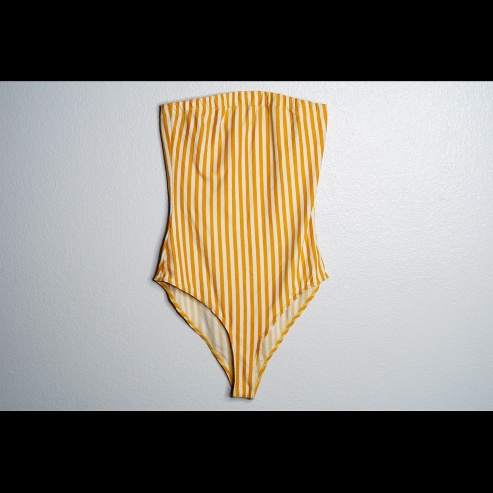 Yellow and white body suit